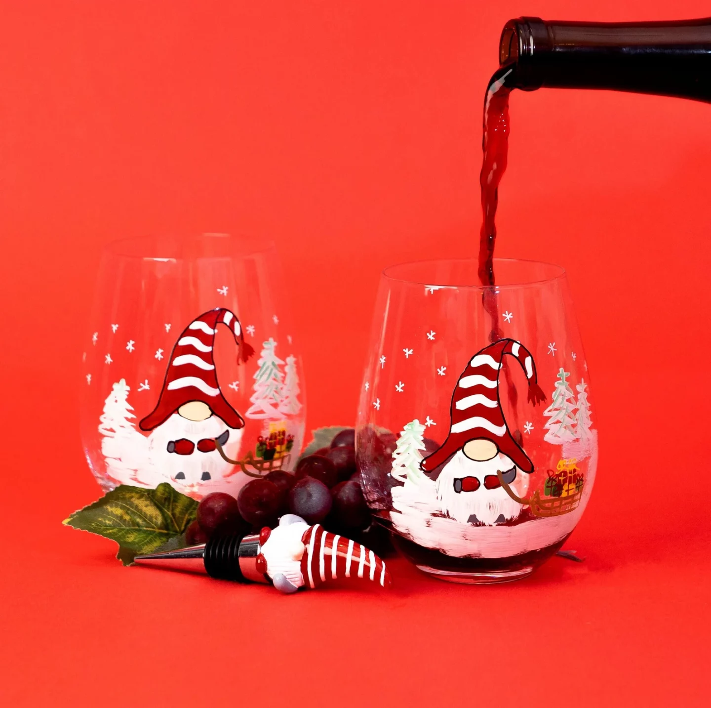 Wine being poured into a Christmas Gnome wine glass