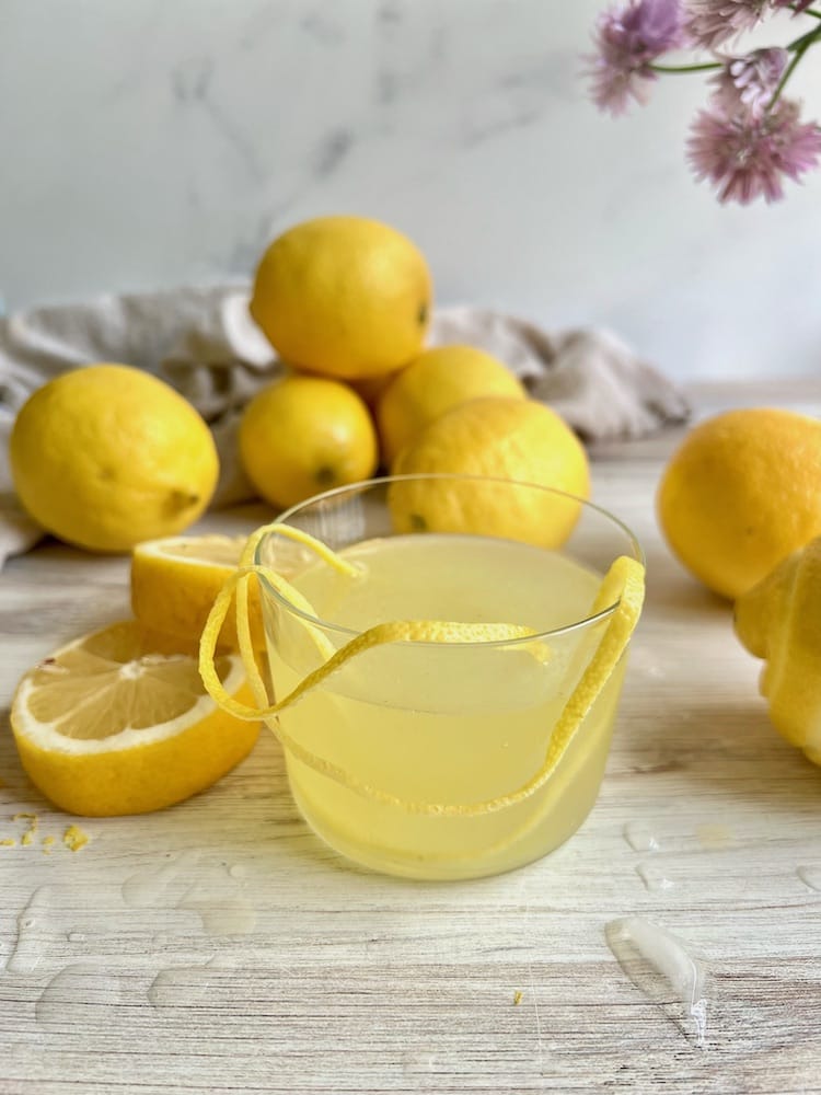 Amalfi Limoncello Cocktail in a glass with lemons