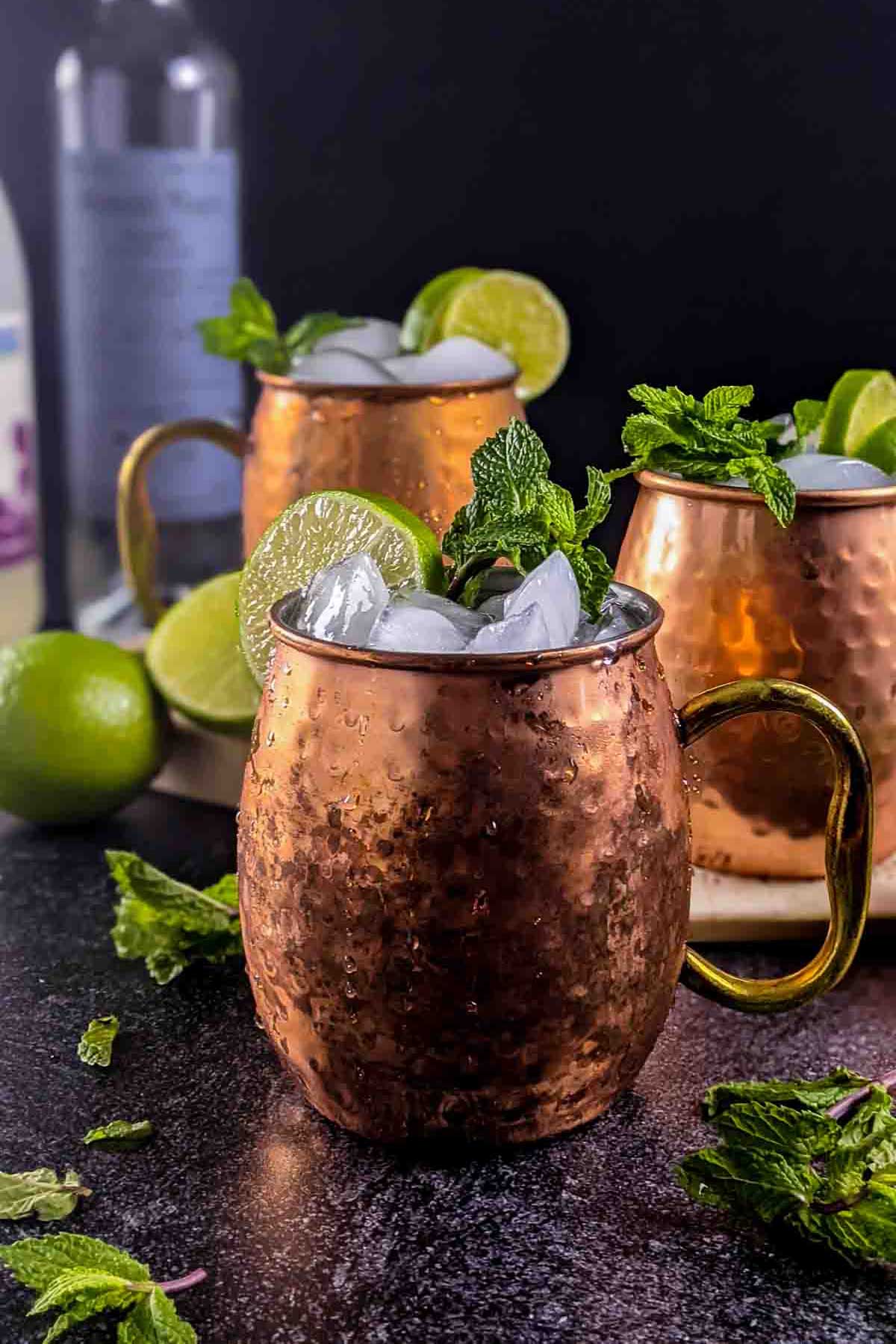 Mezcal Mule Cocktails in a brown cup with a handle.