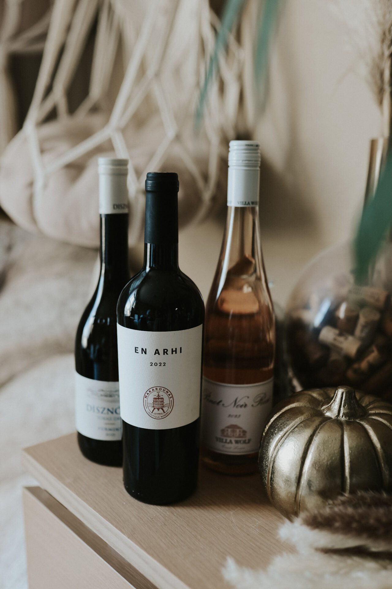 Three bottles of EU Wines sitting on a table