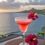 Hibiscus Margarita in a glass with sunset view