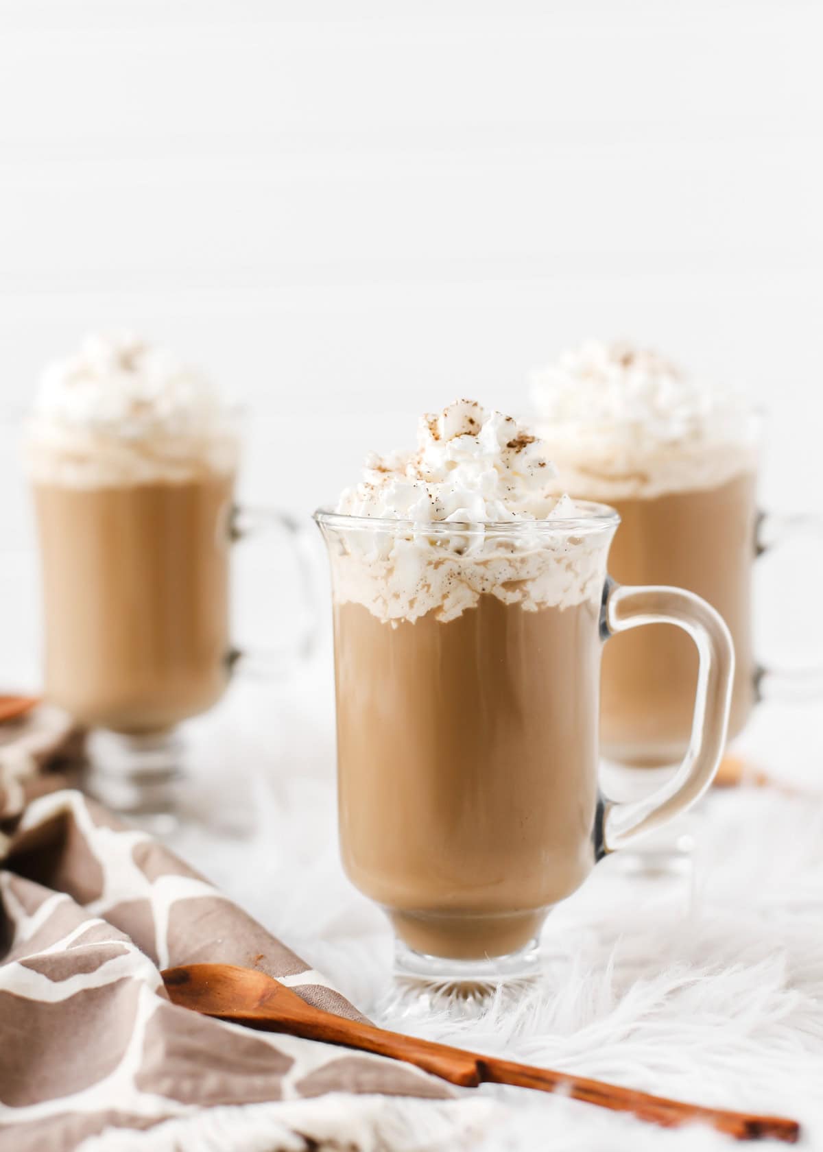 Pumpkin Spice Kahula Coffee Cocktails in three glass cups with handles