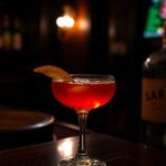 Sazerac Recipe in a glass with a dark background