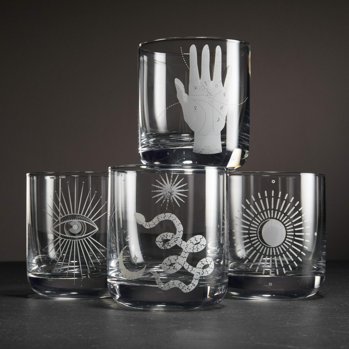 Occult symbols etched onto old fashion glasses