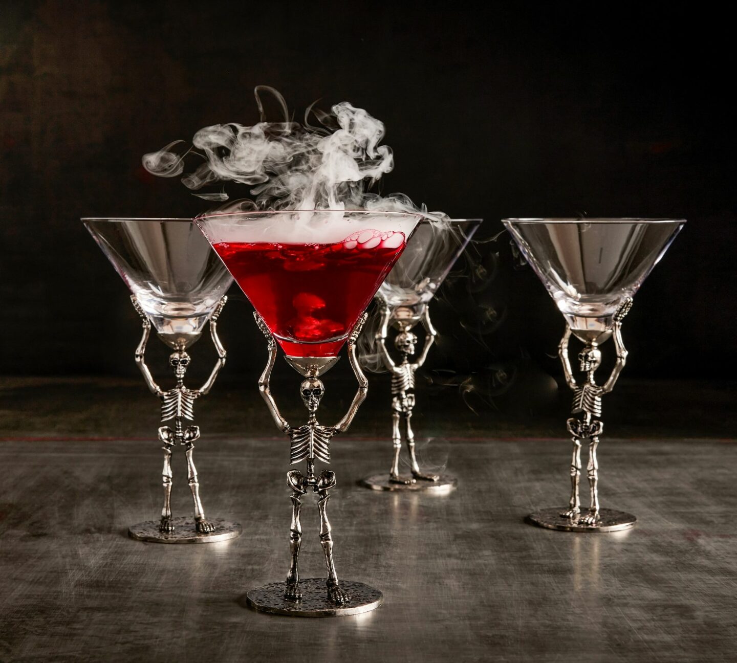 Silver skeletons used as stem of martini glasses